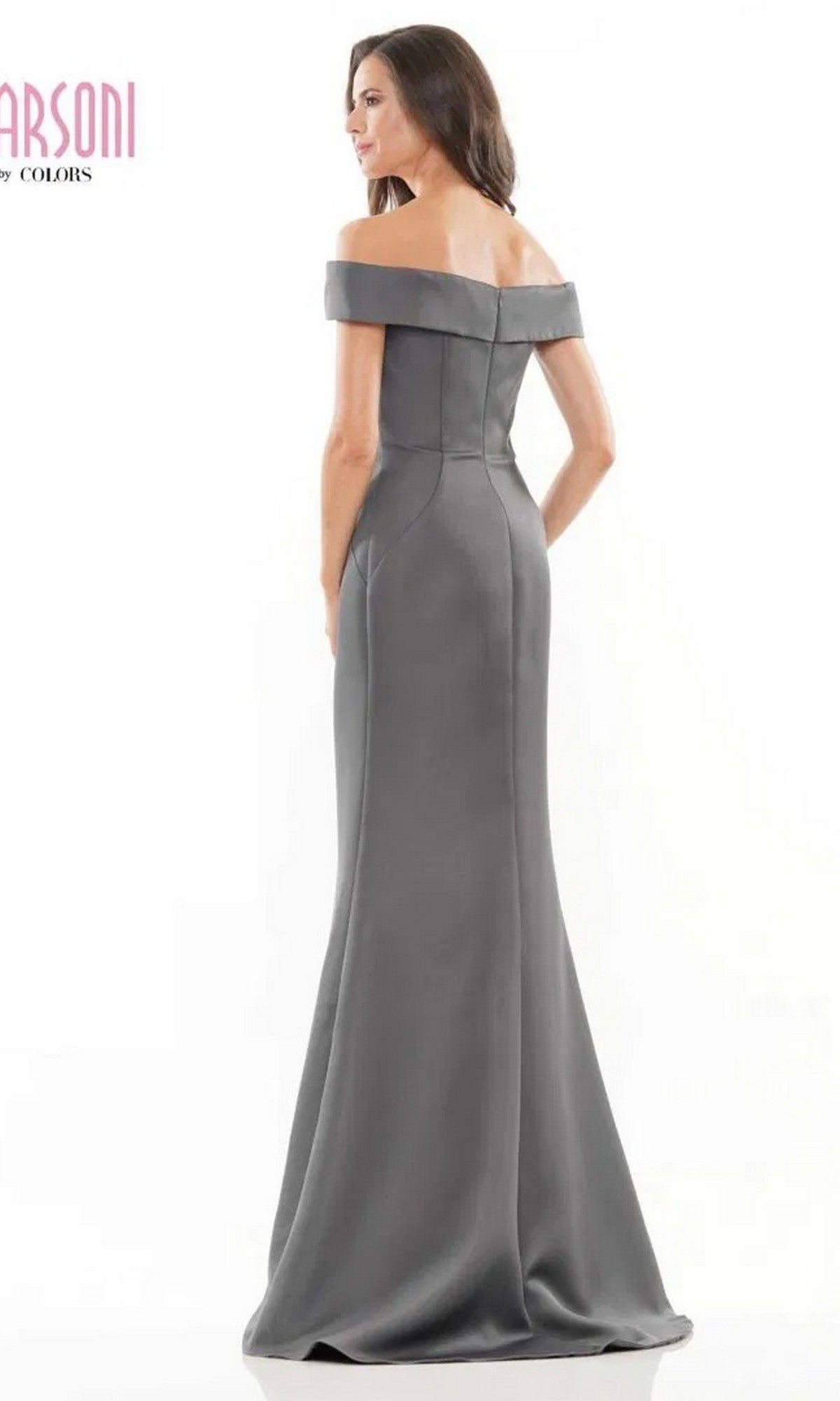 A woman stands with her back to the camera against a plain white background, modeling the Marsoni MV1003 Long Formal Dress, an off-the-shoulder satin evening gown with a fit-and-flare silhouette.
